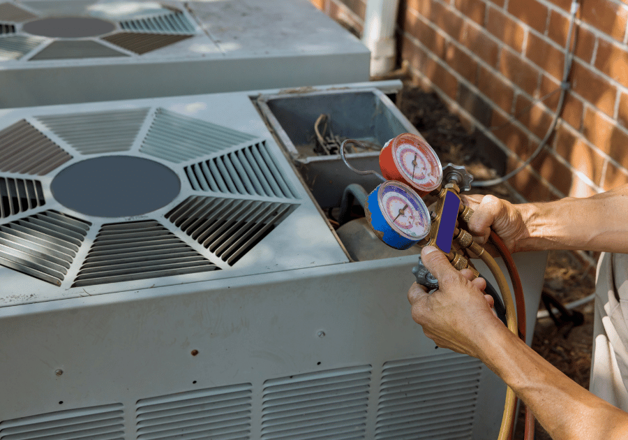 Technician servicing a residential air conditioning system
