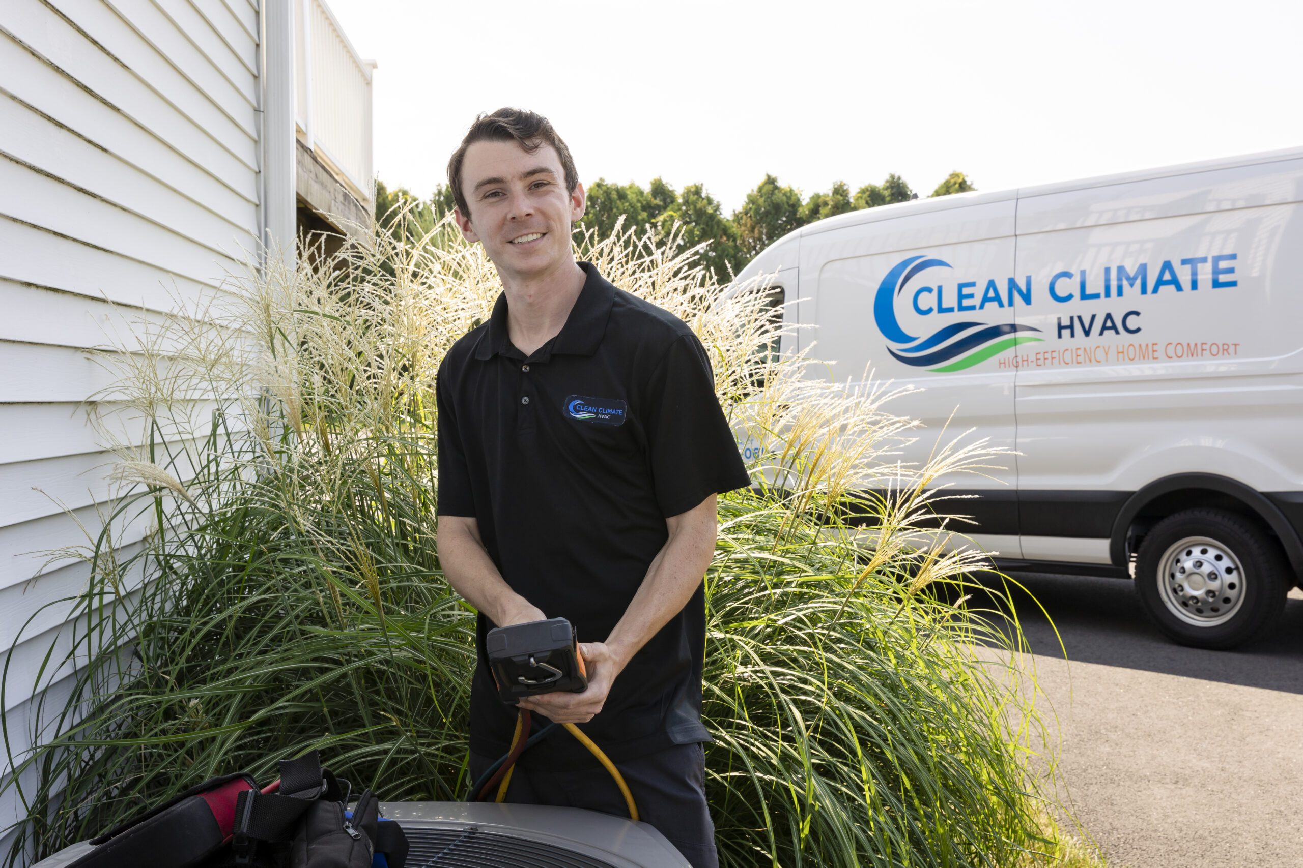 Technician servicing residential heating equipment during a scheduled maintenance visit