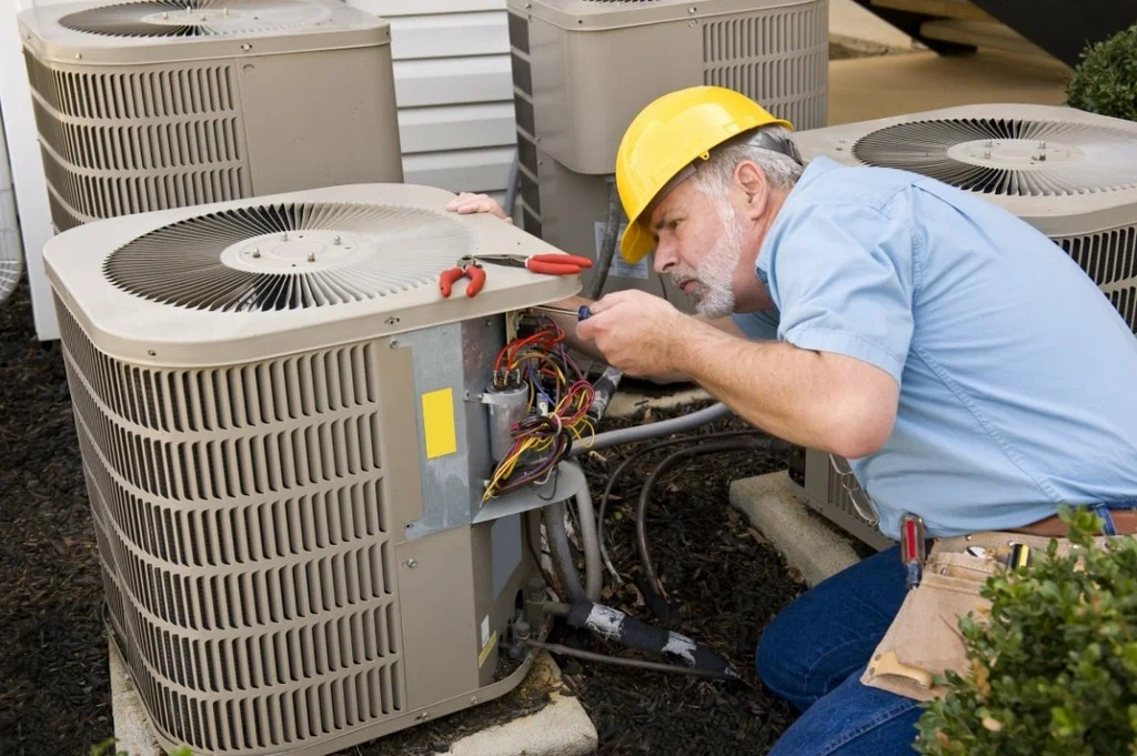 Outdoor air conditioning condenser installed beside a Connecticut home